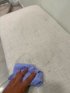 couch stain left untreated to avoid fabric damage
