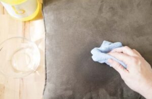 Sticky residue on a fabric couch cushion before cleaning