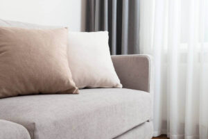 Couch fabric can feel clean while odors remain trapped inside the foam and padding