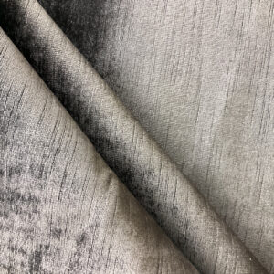 Velvet and suede couch fabric showing delicate pile texture and surface sensitivity
